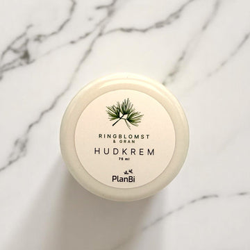 Hudkrem med ringblomst og gran